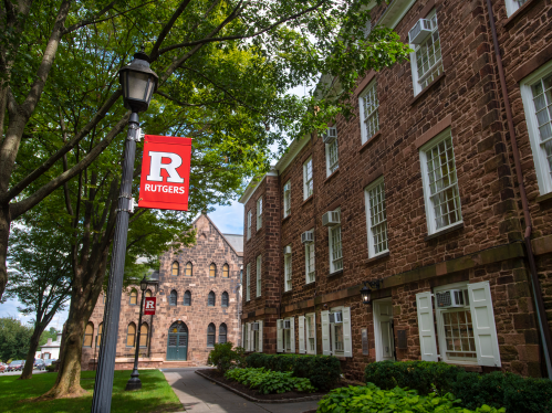 Block R banner behind Winants on Old Queens campus